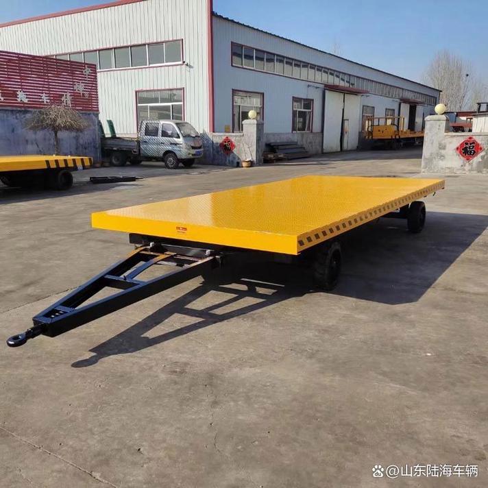 工厂平板牵引货物运输车的多元化应用场景及其在货物运输代理中的战略价值
